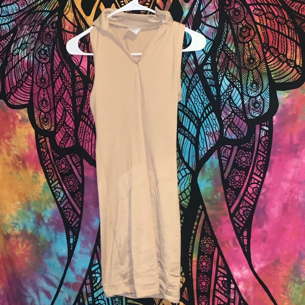 dress is a extra small, cream colored and comfortable and easy to dress up with